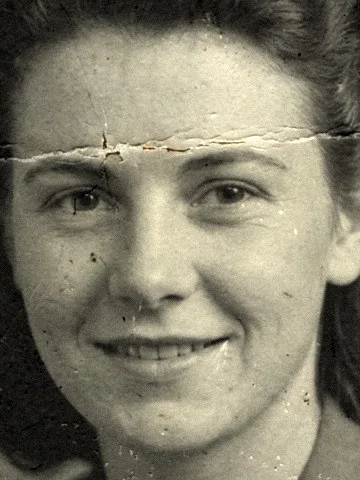 Before: a face crossed by a crease and scratches