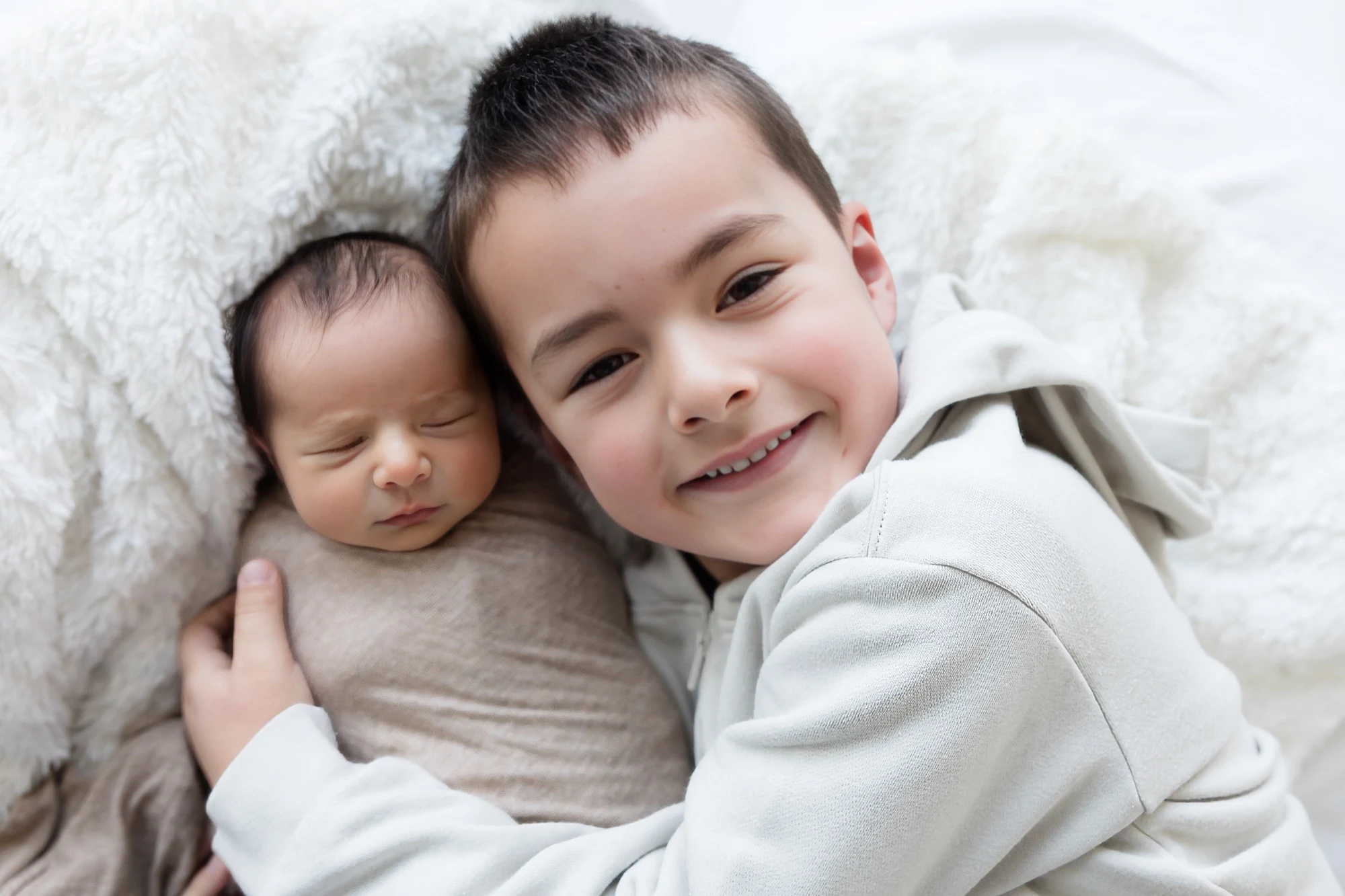 Newborn with their older sibling, photographed at The George Centre, Gledswood Hills