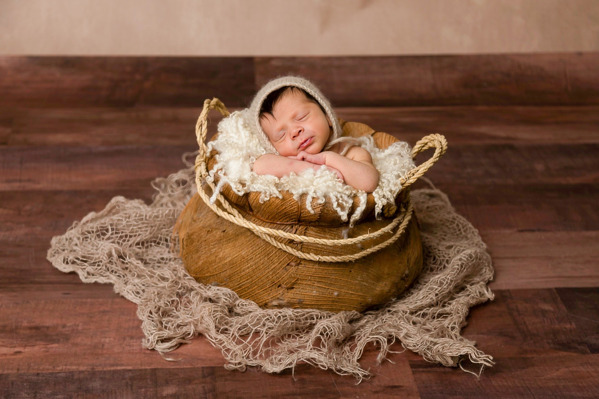 A newborn cradled in soft fabric — Faithful Photography Sydney