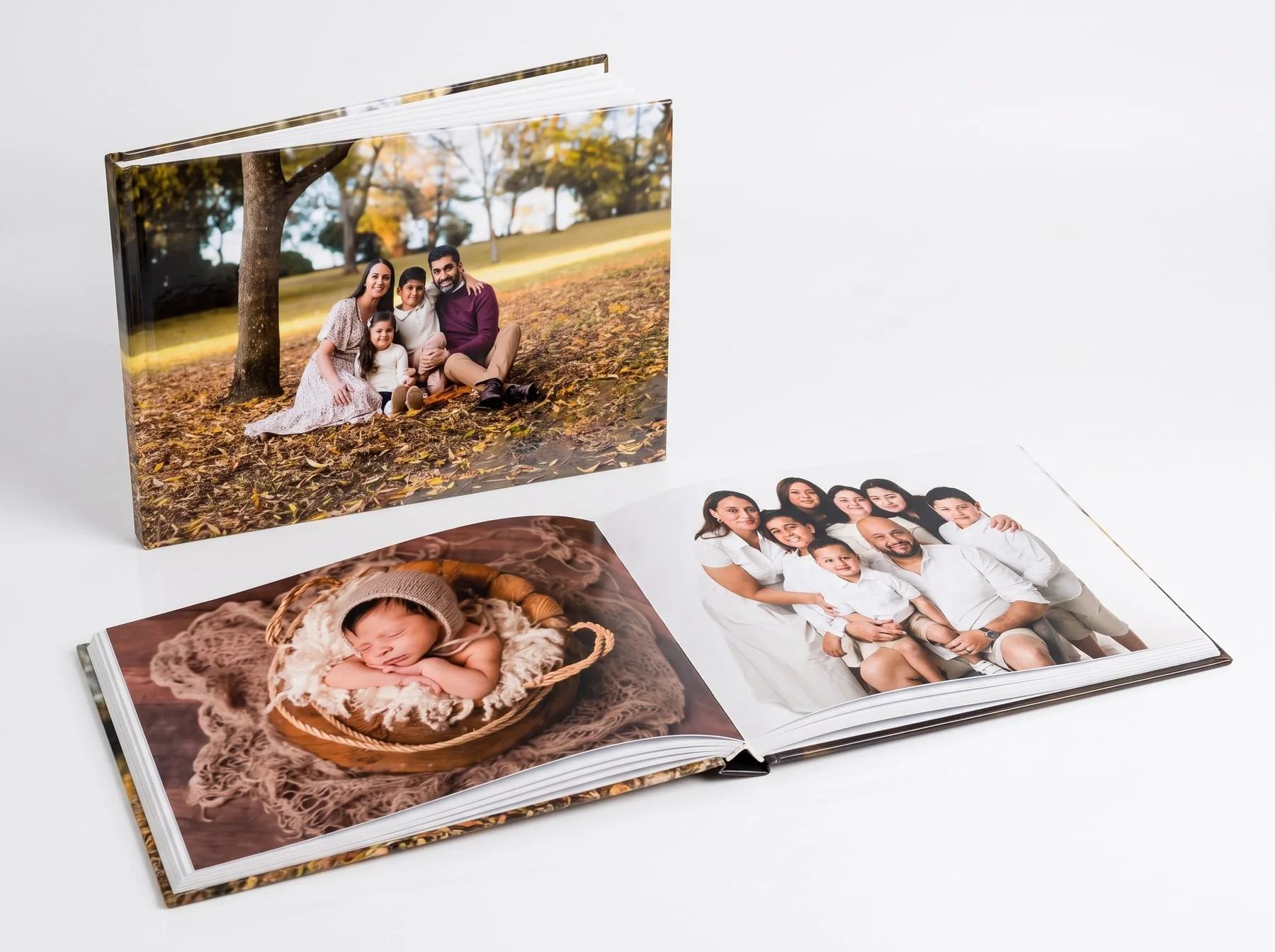 A Faithful Photography padded-cover photo book shown closed and open on a double-page spread
